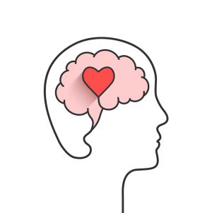 Human head and brain silhouette with heart shape as love, mental health or emotional intelligence concept